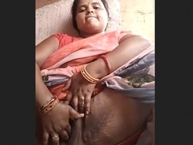Rural Indian damsel drains with her