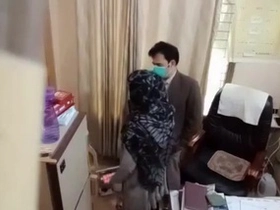 Pakistani physician examines woman's