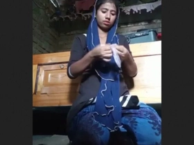 A Bengali girl  herself with her arms in