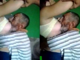Chubby Arab woman gives elderly man